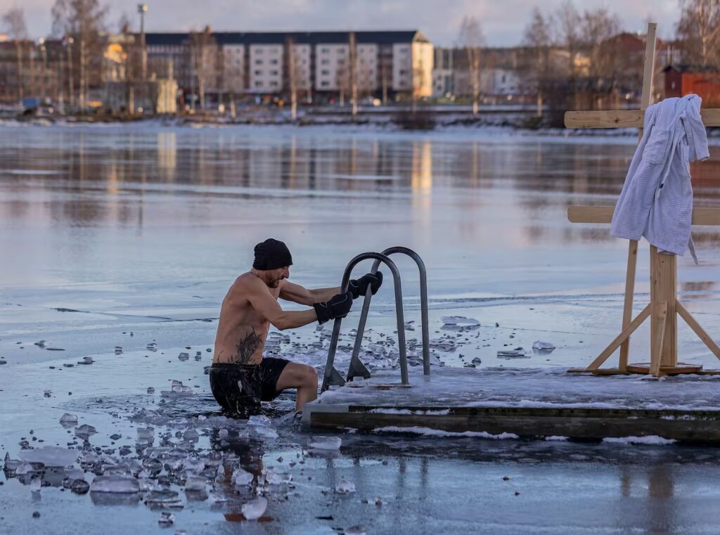 Shirtless man in freezing lake
