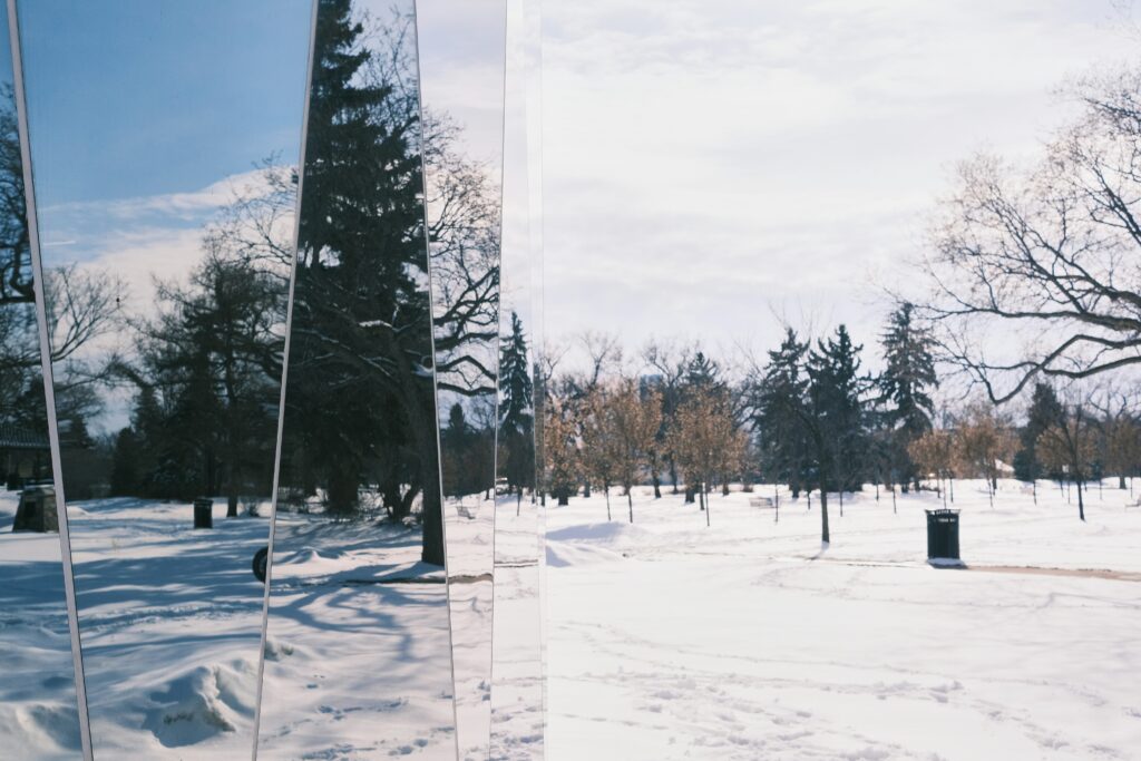 Glass resort mirroring winter scenery
